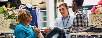 Employee talking to customers