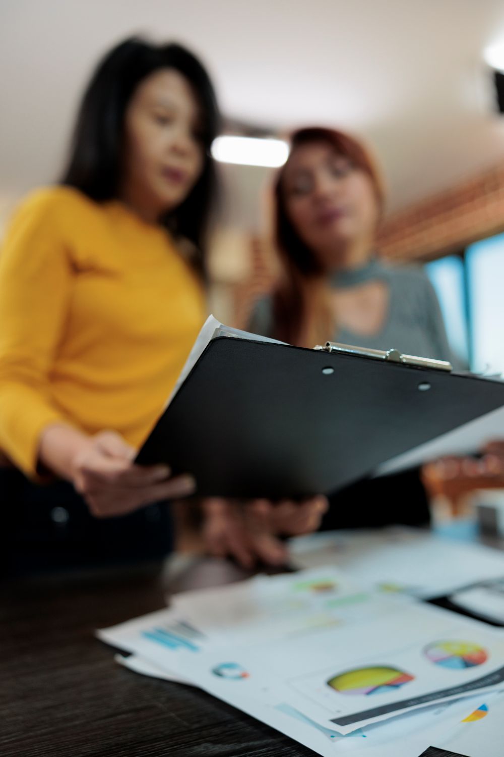 A team reviewing documents and plans with care (placeholder image).